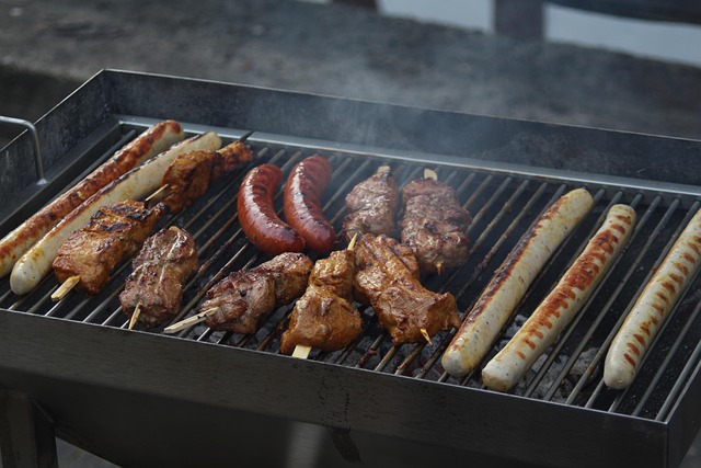 Steaks and burgers cooking on a barbecue grill